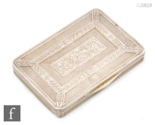 A continental silver cushioned rectangular box with engine turned and foliate engraved decoration to