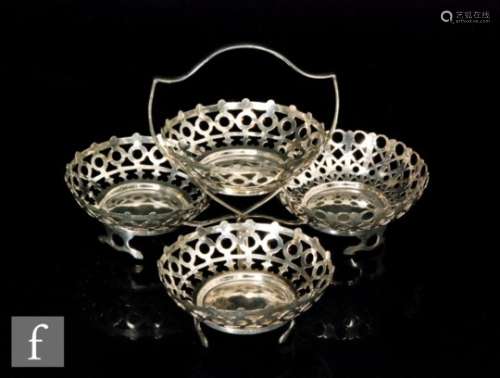 A hallmarked silver table centre piece with four pierced circular bon bon dishes to a plain stand