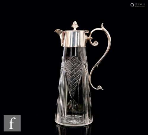 An early 20th Century silver plated and clear glass claret jug, tapering diamond cut clear glass