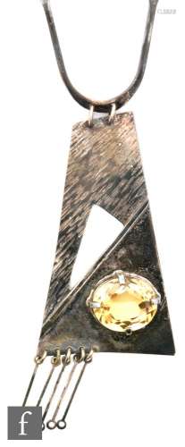 A later 20th Century silver pendant set with single citrine to a part planished rectangular drop