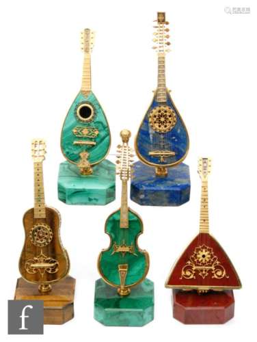A collection of five continental miniature silver gilt display instruments to include mandolins