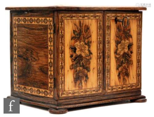 A 19th Century Tunbridgeware mosaic inlaid table cabinet fitted with three drawers enclosed by a