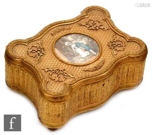 A late 19th Century French gilt casket of cartouche form with silk lined floral interior enclosed by