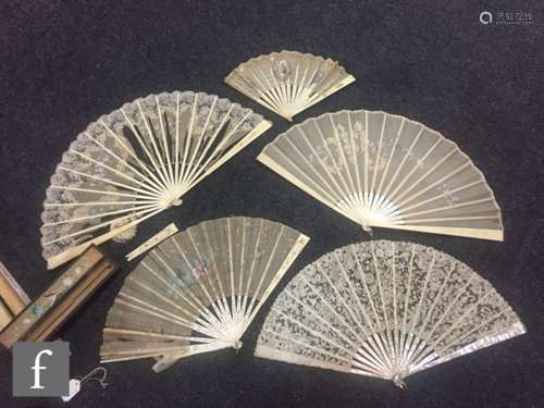 A 19th Century sequin decorated and overpainted fan with scenes of children playing with