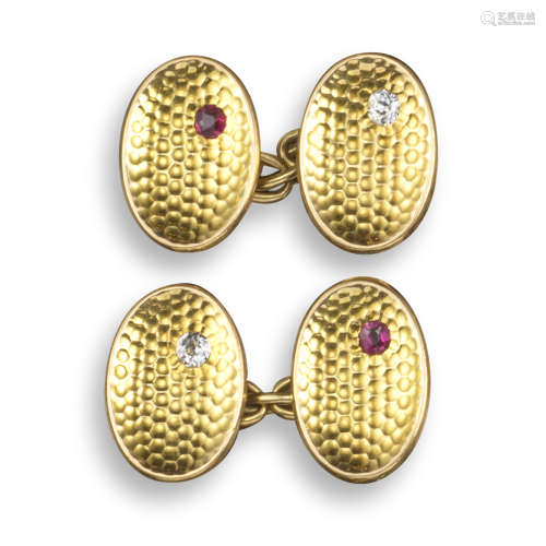 A pair of oval textured gold cufflinks
