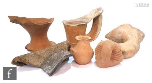 A Roman amphora handle and neck, another amphora neck and various ancient pottery sherds and