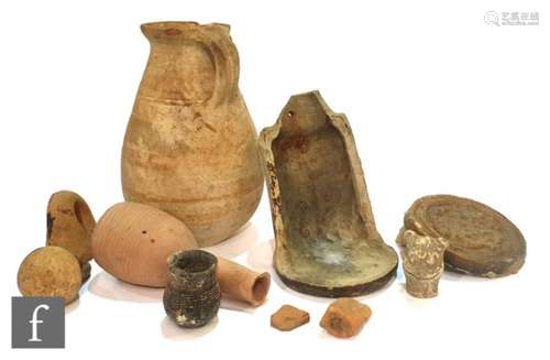 A cuneiform tablet, a terracotta jug with hand written note purporting to be Roman and purchased