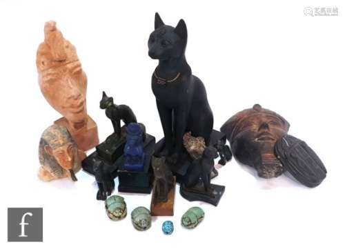 A bronze statuette of an Egyptian cat after the antique, a resin lapis style figure of a baboon in