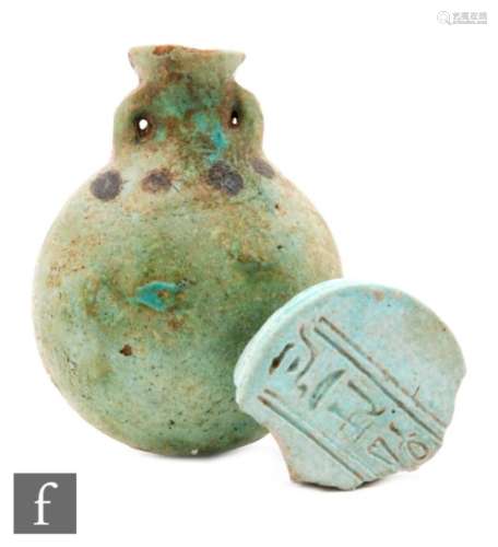 An Egyptian late dynastic faience ?pilgrim? flask with two lugs and black dot decoration, 8cm and an
