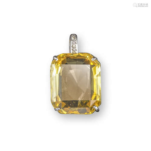 A yellow sapphire and diamond pendant