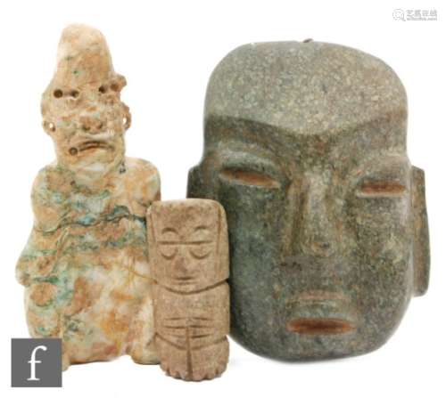 An Olmec style seated stone figure, old repairs, an Olmec style stone ?mask? and a small Mexican