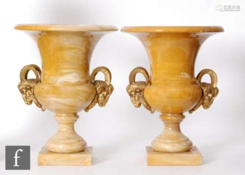 A pair of late 19th Century French yellow and white marble gilt mounted campana shape terrace