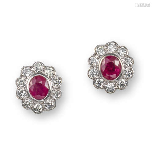 A pair of ruby and diamond cluster earrings