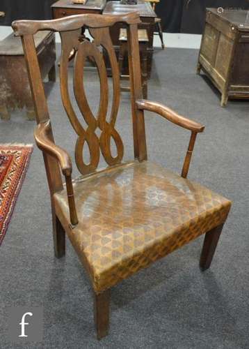 A 19th Century oak carver armchair, with a lattice panel back over a later tooled leather seat.