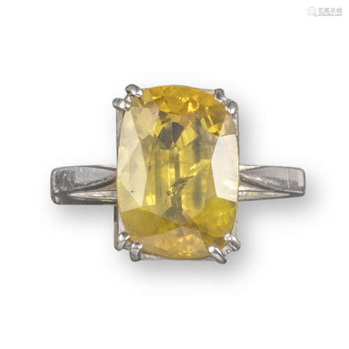 A yellow sapphire solitaire ring
