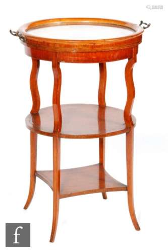 An early 20th Century satinwood etagere or buffet serving table of circular outline, the lift-off