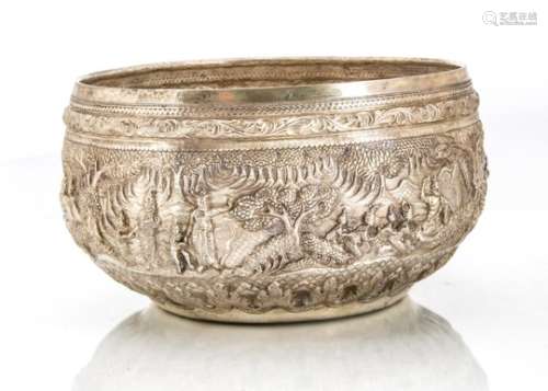 A large early 20th century Indian silver bowl, circular Burmese style with ornate embossed vignettes