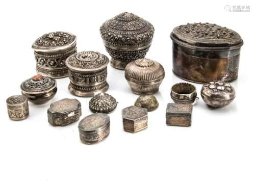 Twelve late 19th and early 20th century Indian and Middle Eastern white metal boxes, seven being