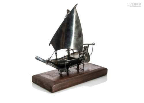 A vintage Middle Eastern white metal model of a dhow, the Arabian boat on wooden stand, 19cm, AF