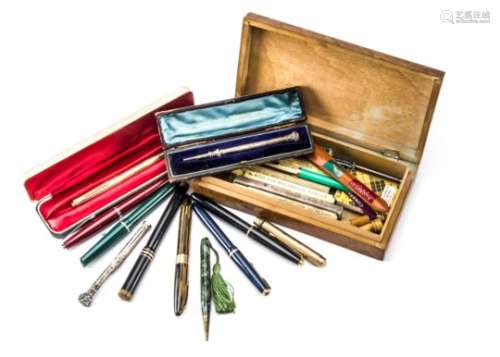 A small collection of fountain pens and pencils, including a Victorian silver pencil in fitted