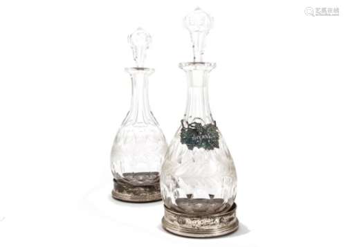 A pair of modern silver wine bottle coasters from B & Co, together with a good pair of cut glass
