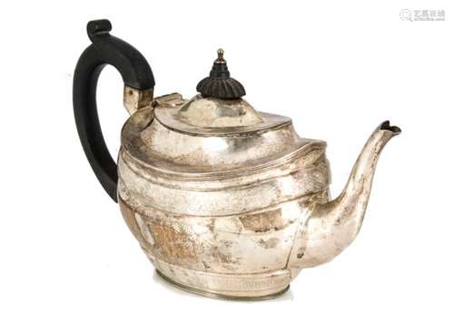 An Edwardian silver teapot, possibly by GM, oval with engraving and applied black handle and finial,