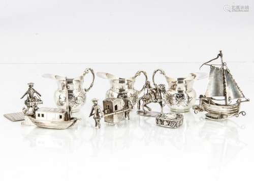 A group of ten small collectable silver and white metal items, including a set of three dolls' house