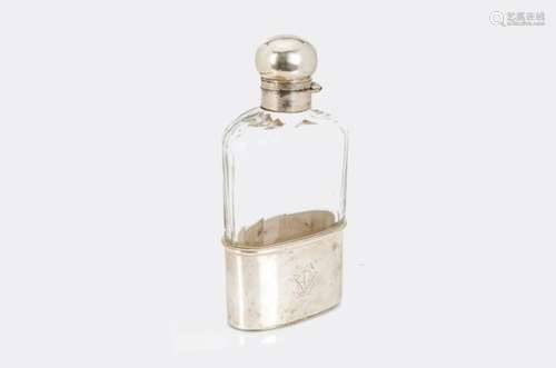 An Edwardian cut glass and silver hipflask from Charles Asprey & George Asprey, faceted body with