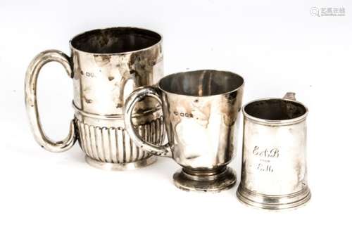 Three silver tankards, including two Christening examples and a larger tankard, 18 ozt (3)