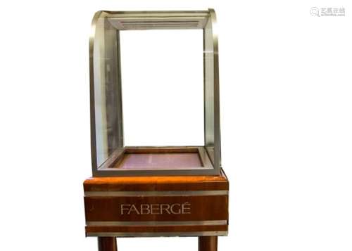 A pair of contemporary fruitwood veneered and glazed retail display cabinets on stands marked