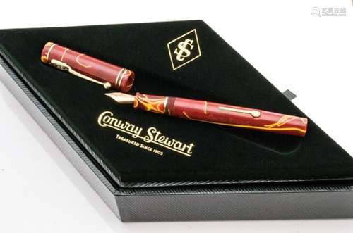 A modern Conway Stewart Dandy fountain pen, in red and yellow, referred to as Yellow Whirl, in box