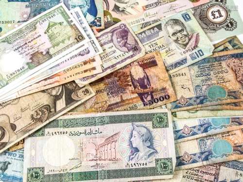 A small collection of world bank notes, with examples from Sri Lanka, Zambia, Ghana, and more (