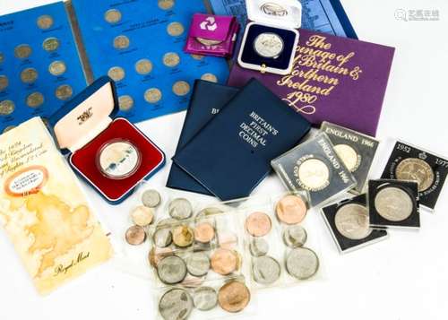 A collection of coins, including a 1977 silver proof crown in case, a cased Israel 2000 silver coin,