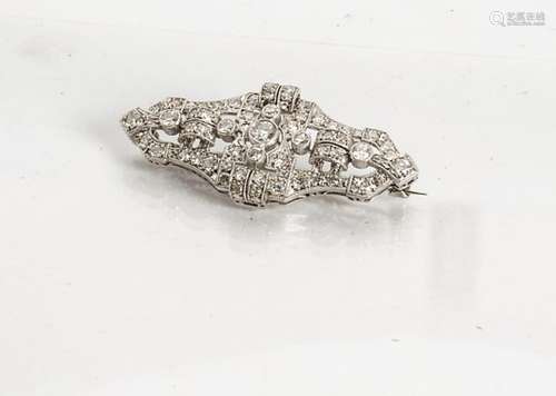 An Art Deco diamond and platinum set architectural brooch, of pierced design centred with old cut