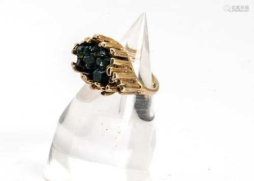 A 9ct gold retro green diopside set dress ring, having natural crystal central stones within a