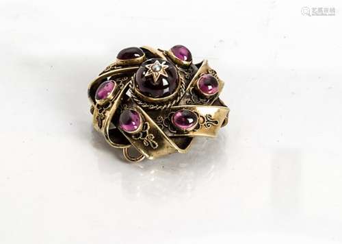 A Victorian gold garnet and seed pearl knot brooch, of octagonal design centred with raised circular