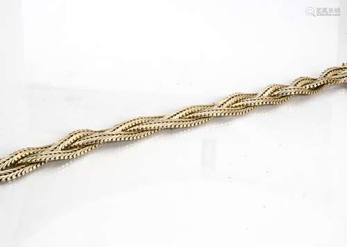 A 9ct gold hallmarked flattened curb link three strand plaited bracelet, with box and tongue clasp