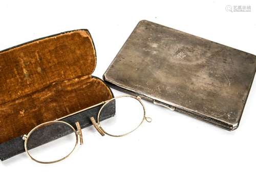 A pair of Edwardian pince-nez, with central pull spring mechanism in fitted case together with a