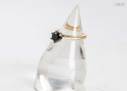 An 18ct gold hallmarked black diamond solitaire, the eight cut diamond in six claw white gold