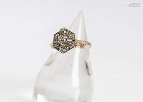 An Art Deco cluster tablet ring, the hexagonal setting centred with three old cut diamonds and