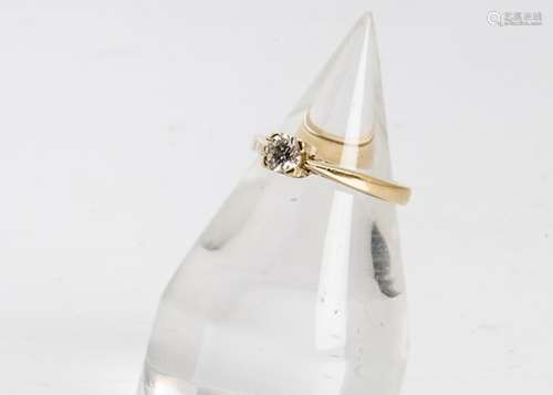 An 18ct gold diamond solitaire, the brilliant cut in four claw setting on a yellow gold mount and