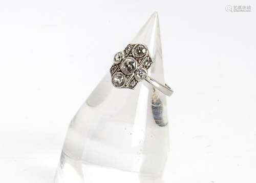 A platinum and diamond Art Deco style dress ring, of tablet design centred with three old cut