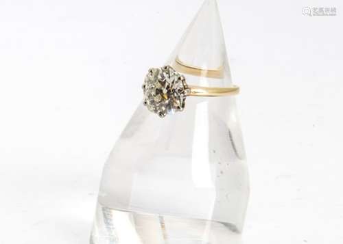 An old cut diamond solitaire, the cushion shaped diamond in an eight claw setting, on a yellow metal