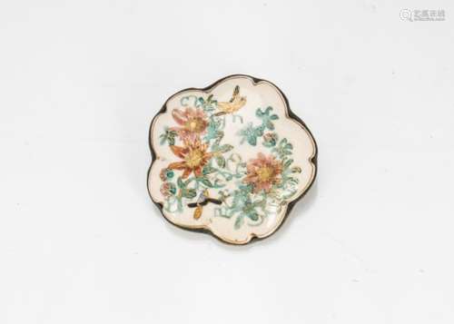 A Meiji period Japanese Satsuma brooch, decorated with song birds and flowers within a gilt border