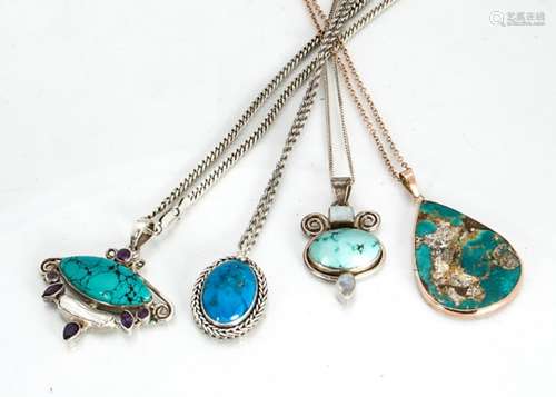 A collection of turquoise set pendants, including a matrix tear shaped example in 9ct gold, a blue