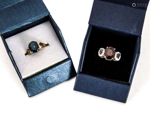 A London blue topaz and diamond dress ring, the oval mixed cut central topaz set by illusion set