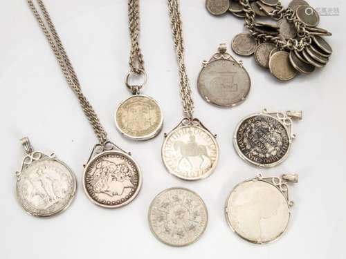 A collection of silver and nickel coin mounted pendants and bracelets, including an 1880 US