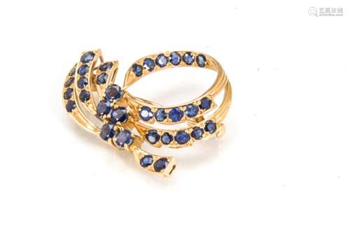 A sapphire and gold scroll brooch, the circular and oval bale sapphires in scroll design all in