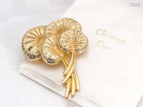 A Christian Dior gilt metal costume brooch, stylised palm leaves, with paste stones, in fitted