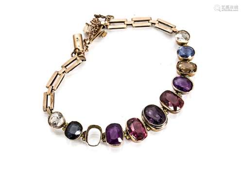 A multi gem set bracelet, the circular and oval mixed cut gem stones in colett settings set with